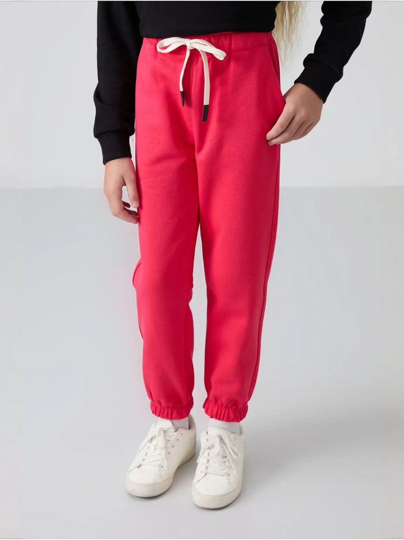 Pantalones youth de algodón y poliéster tommy Rosa fluo/Solinotes - Kiabi