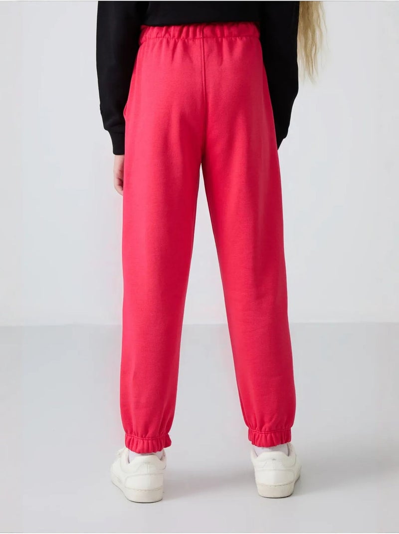 Pantalones youth de algodón y poliéster tommy Rosa fluo/Solinotes - Kiabi