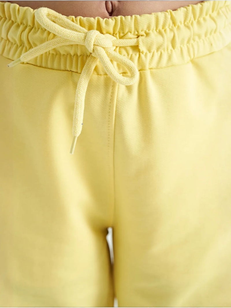 Pantalones youth unisex de mezcla de algodón tommy Amarillo limón - Kiabi