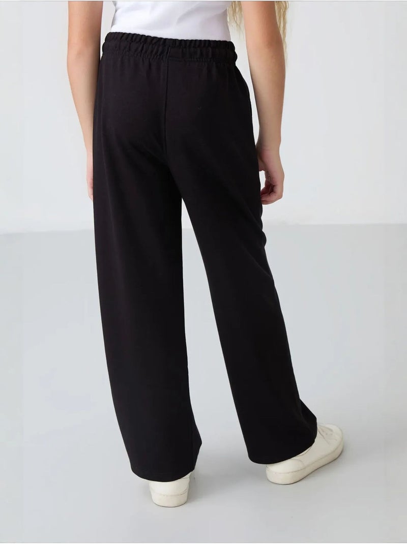 Pantalones youth unisex de mezcla de algodón tommy Negro - Kiabi