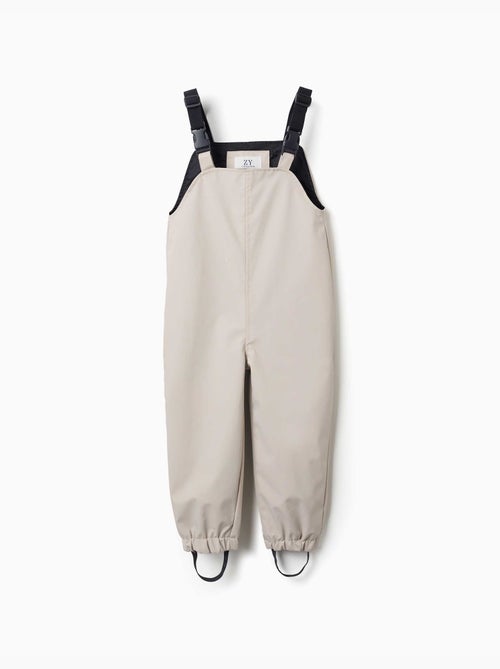 Peto para lluvia con tirantes ajustables - Kiabi Peto para lluvia con tirantes ajustables - Kiabi
