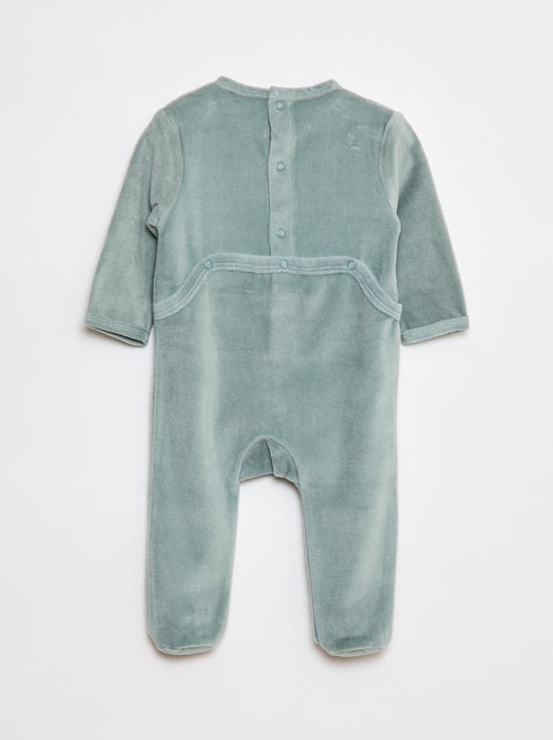Pijama de terciopelo con pies y dibujo delantero - Kiabi Pijama de terciopelo con pies y dibujo delantero - Kiabi