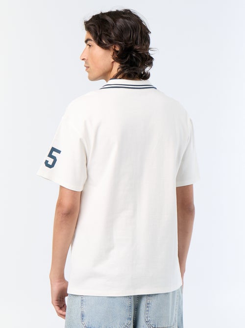 Polo con inscripciones bordadas de manga corta - Kiabi