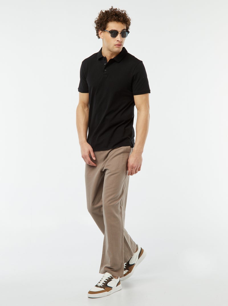 Polo de punto liso con manga corta negro - Kiabi