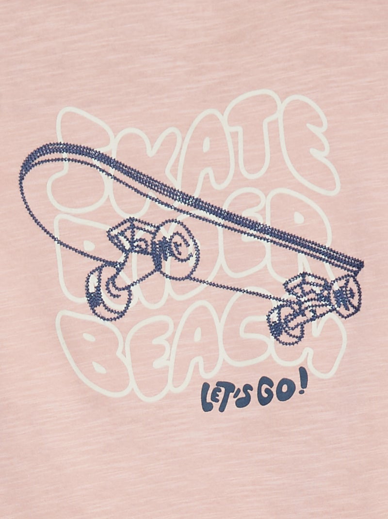 Polo liso con estampado ROSA - Kiabi