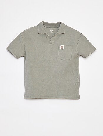 Polo loose con bolsillo