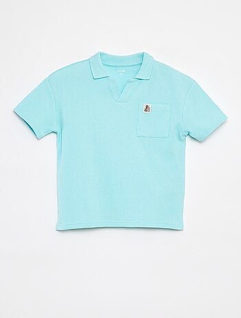 Polo loose con bolsillo