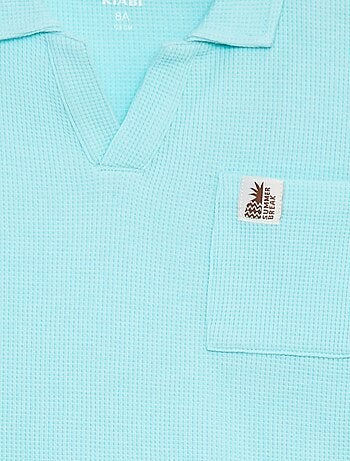 Polo loose con bolsillo