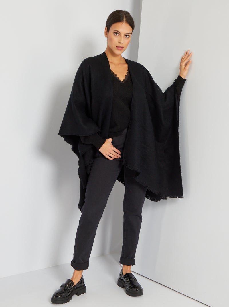 Poncho con pequeños flecos negro - Kiabi