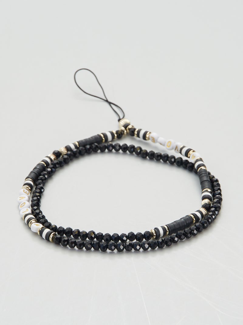 Portateléfono con perlas negro/blanco - Kiabi