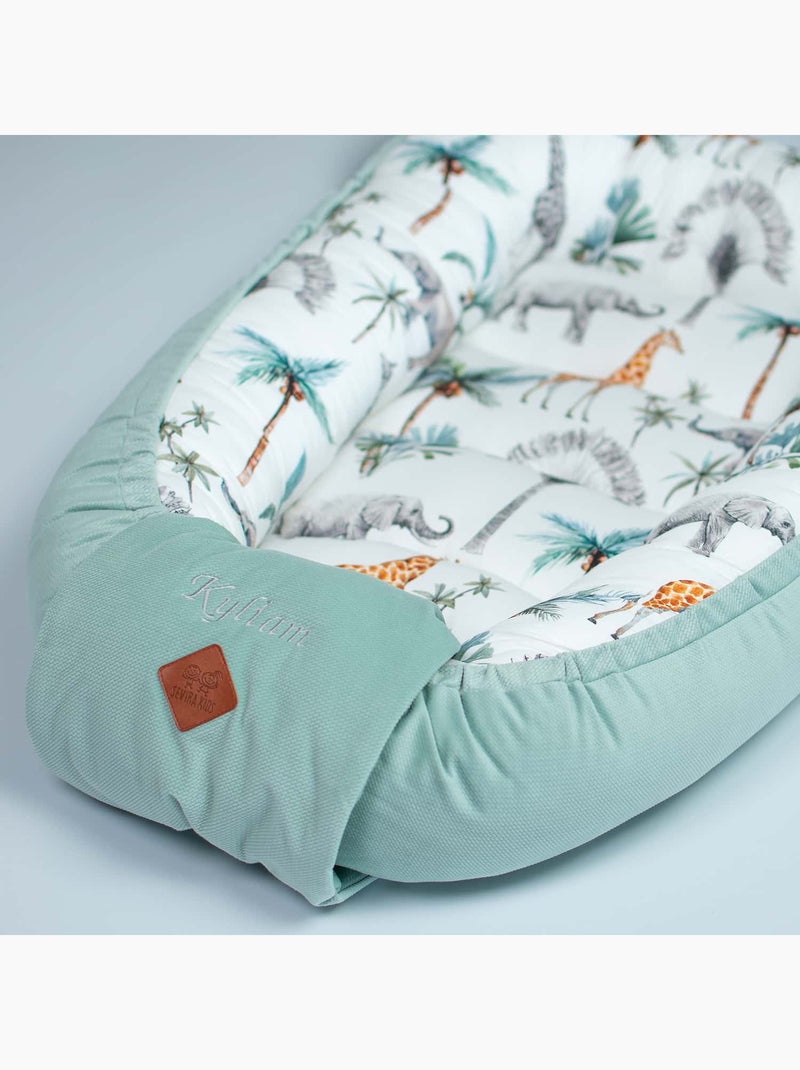 Reductor de cuna de nido para bebés acolchado, safari | SEVIRA KIDS Verde agua - Kiabi
