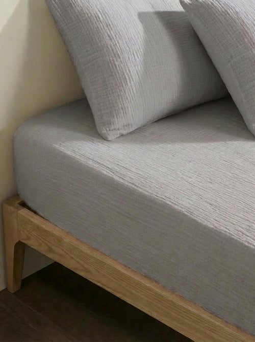 Sábana bajera ajustable para 2 personas (150x200cm) de gasa de algodón - Kiabi Home - Kiabi Sábana bajera ajustable para 2 personas (150x200cm) de gasa de algodón - Kiabi Home - Kiabi
