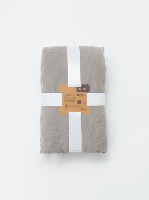 Sábana bajera ajustable para 2 personas (150x200cm) de gasa de algodón - Kiabi Home - Kiabi Sábana bajera ajustable para 2 personas (150x200cm) de gasa de algodón - Kiabi Home - Kiabi