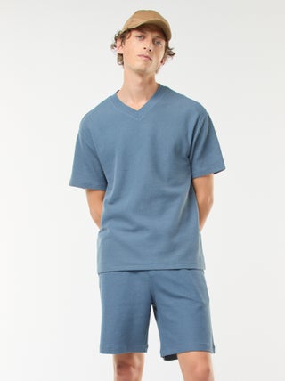 Short deportivo con bolsillos de punto