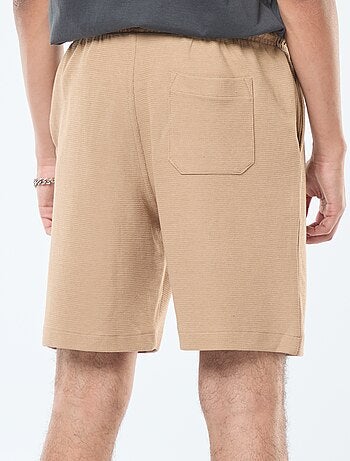 Short deportivo con bolsillos de punto