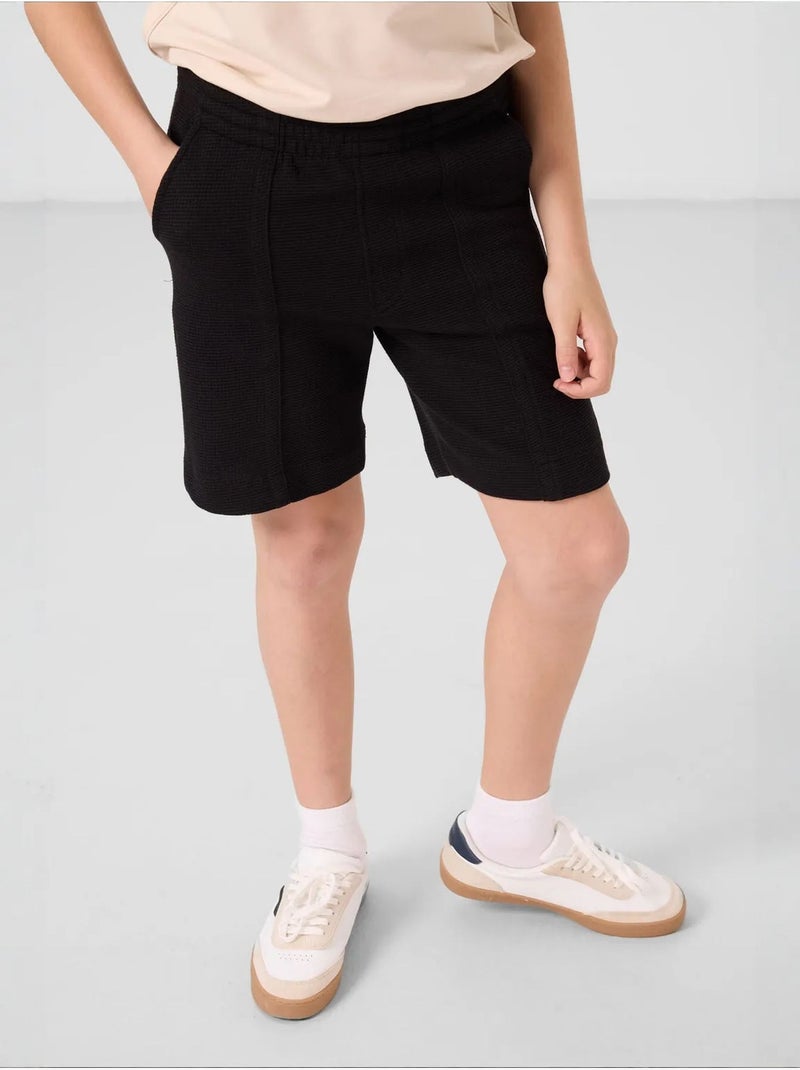 Shorts youth de mezcla de algodón tommy Negro - Kiabi