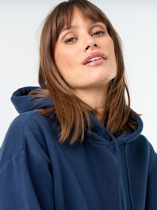 Sudadera con capucha lisa y bolsillo canguro - Kiabi Sudadera con capucha lisa y bolsillo canguro - Kiabi