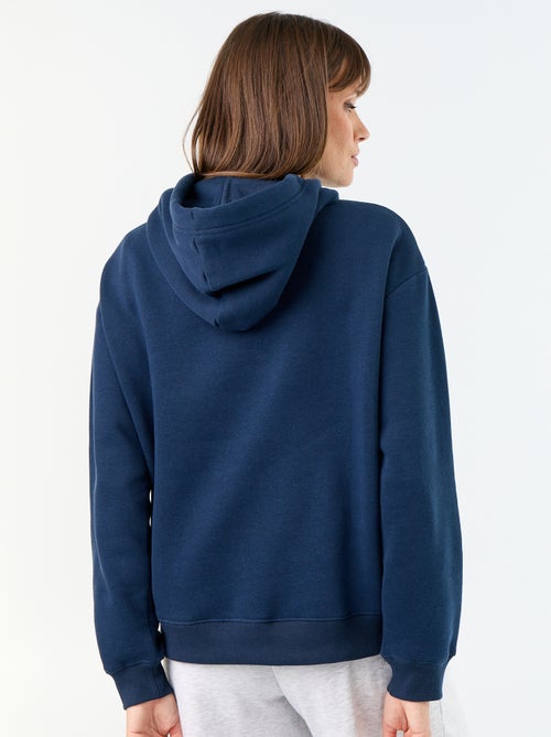 Sudadera con capucha lisa y bolsillo canguro - Kiabi Sudadera con capucha lisa y bolsillo canguro - Kiabi