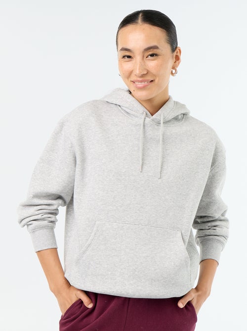 Sudadera con capucha lisa y bolsillo canguro - Kiabi Sudadera con capucha lisa y bolsillo canguro - Kiabi