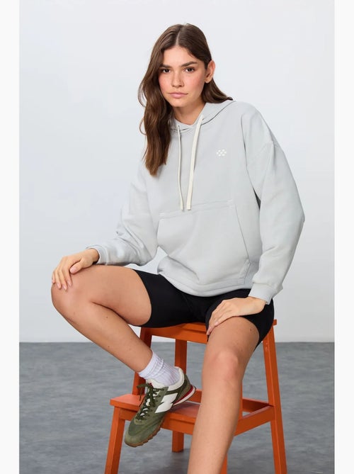 Sudadera con capucha oversize y bolsillo tommy - Kiabi Sudadera con capucha oversize y bolsillo tommy - Kiabi
