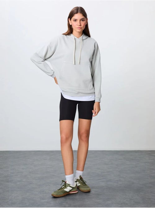 Sudadera con capucha oversize y bolsillo tommy - Kiabi Sudadera con capucha oversize y bolsillo tommy - Kiabi