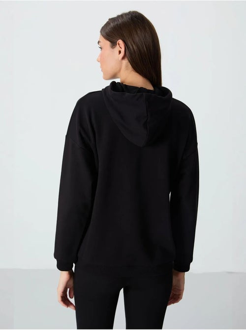 Sudadera con capucha oversize y bolsillo tommy - Kiabi Sudadera con capucha oversize y bolsillo tommy - Kiabi