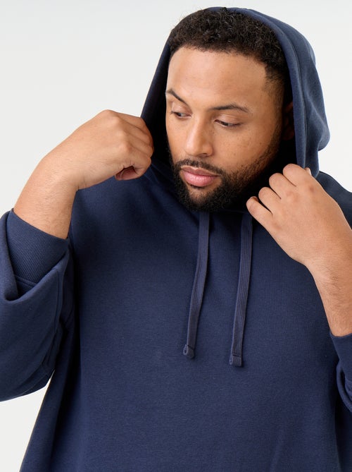 Sudadera con capucha y bolsillo canguro - Kiabi Sudadera con capucha y bolsillo canguro - Kiabi