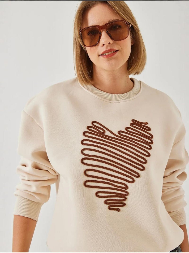 Sudadera con corazón bordado lucci Crema - Kiabi