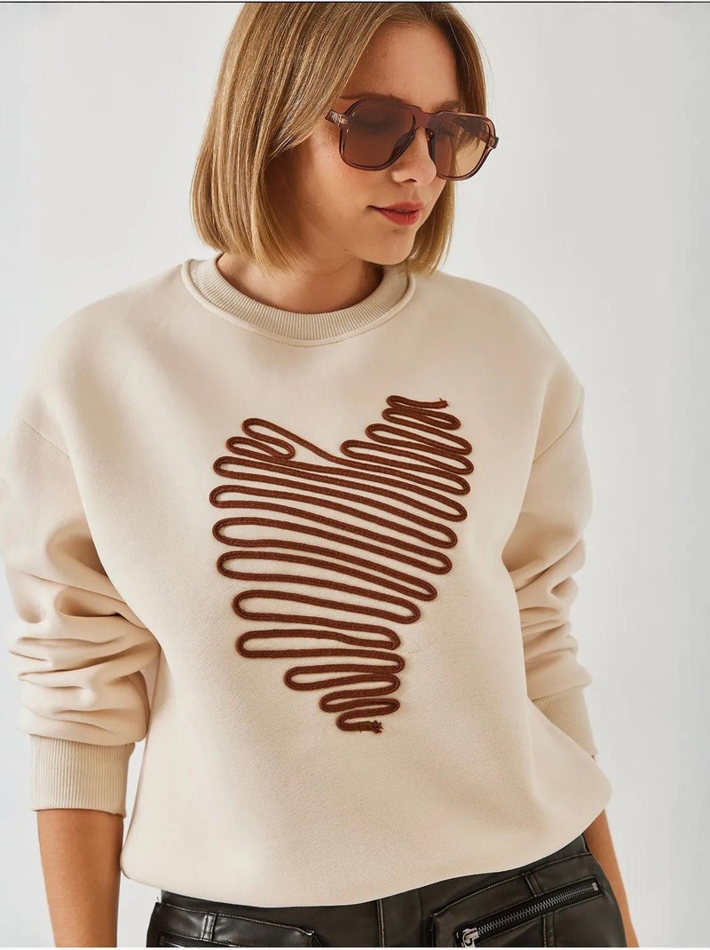 Sudadera con corazón bordado lucci Crema - Kiabi