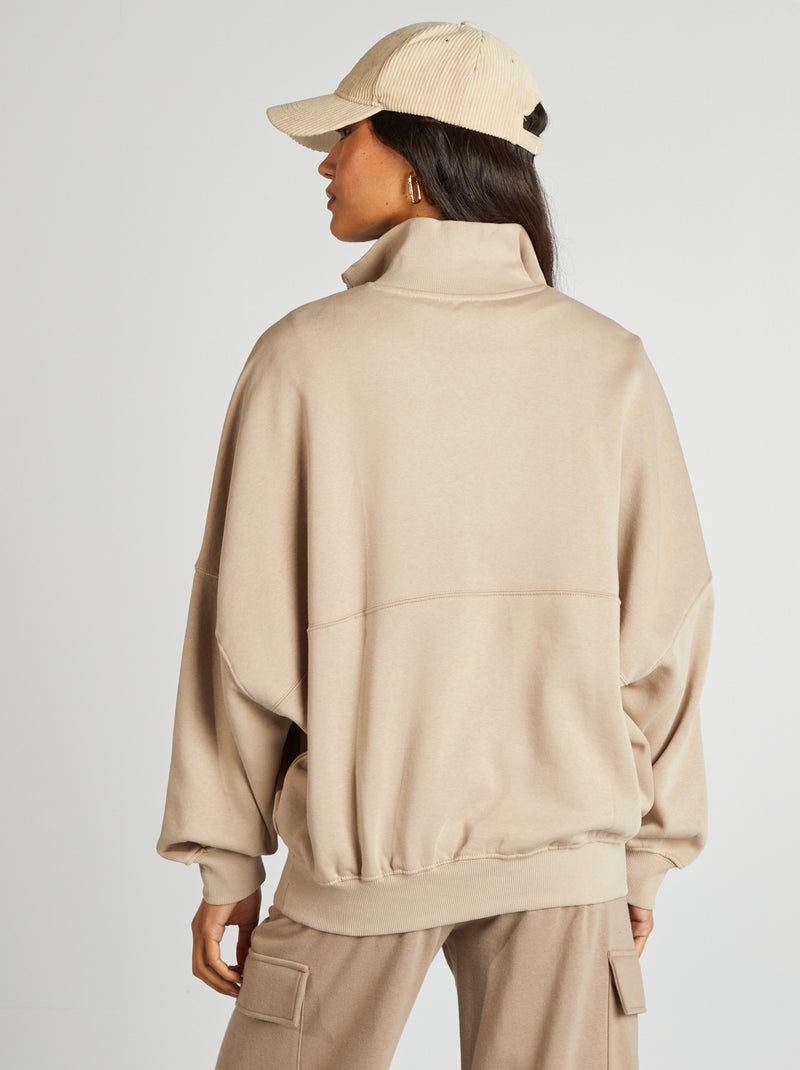 Sudadera con cremallera en el cuello y bolsillo tipo canguro beige - Kiabi