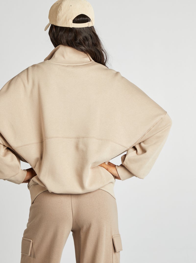 Sudadera con cremallera en el cuello y bolsillo tipo canguro beige - Kiabi
