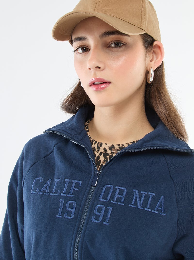 Sudadera corta con cremallera y mensaje bordado Azul - Kiabi