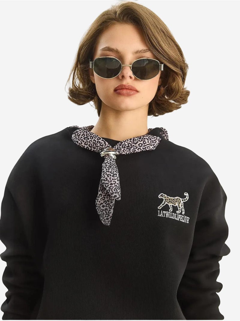 Sudadera de cuello redondo bordada con estampado de leopardo de lucci Negro - Kiabi
