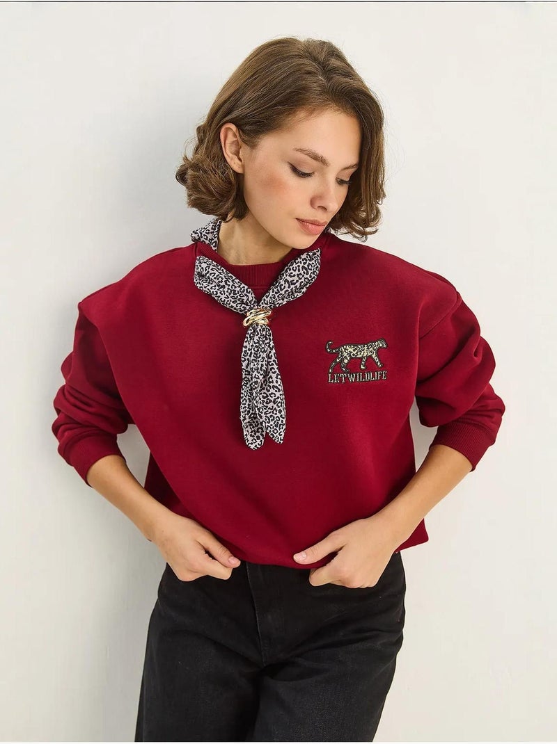 Sudadera de cuello redondo bordada con estampado de leopardo de lucci Rojo burdeos - Kiabi