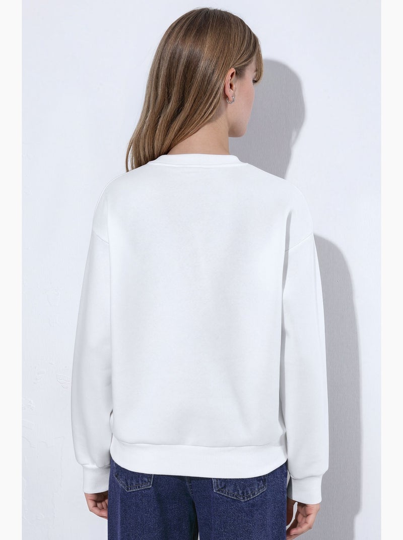 Sudadera de cuello redondo con bordado de corazón hiccup Crema - Kiabi