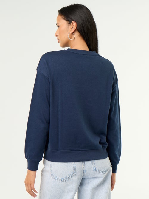 Sudadera de cuello redondo con inscripción delantera - Kiabi Sudadera de cuello redondo con inscripción delantera - Kiabi