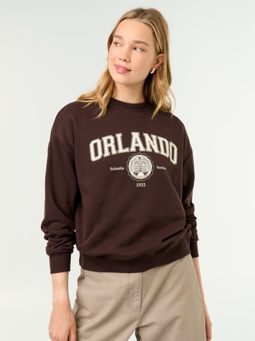 Sudadera de cuello redondo con inscripción delantera - Kiabi Sudadera de cuello redondo con inscripción delantera - Kiabi