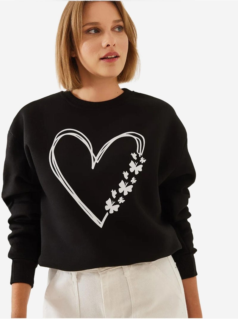 Sudadera de hilo cepillado con cuello redondo y detalle de corazón estampado lucci Negro - Kiabi