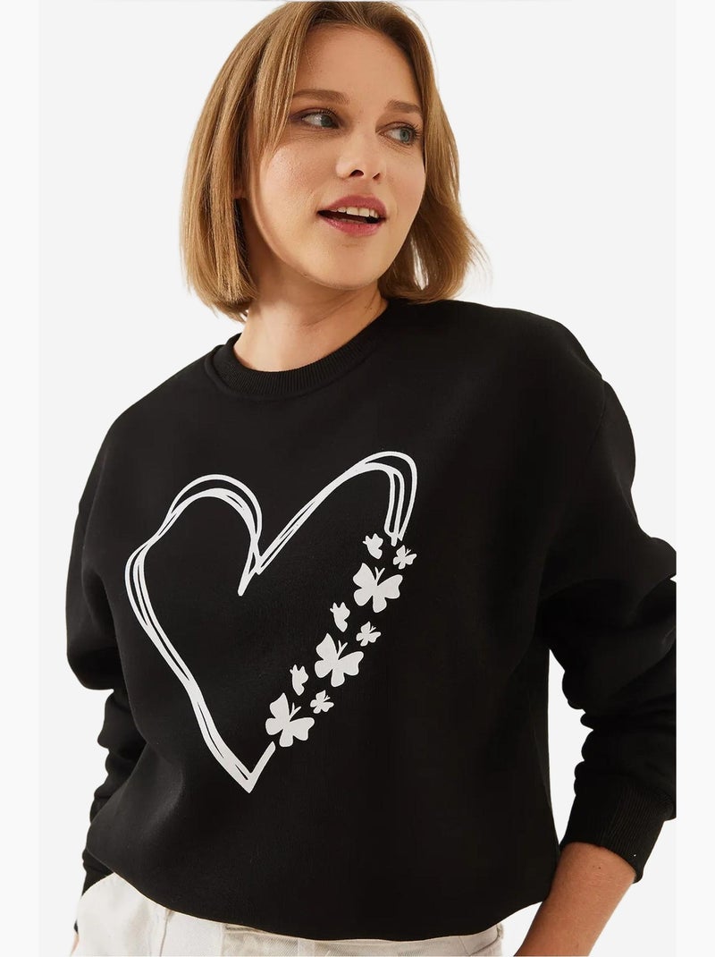 Sudadera de hilo cepillado con cuello redondo y detalle de corazón estampado lucci Negro - Kiabi