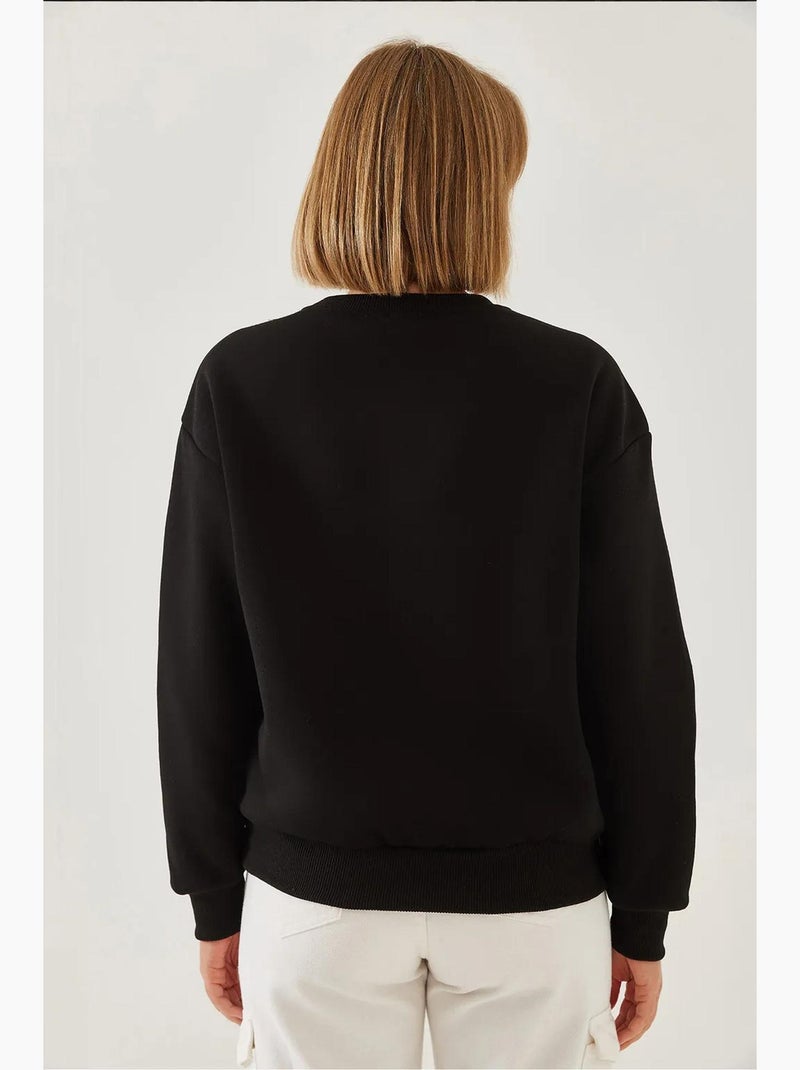 Sudadera de hilo cepillado con cuello redondo y detalle de corazón estampado lucci Negro - Kiabi