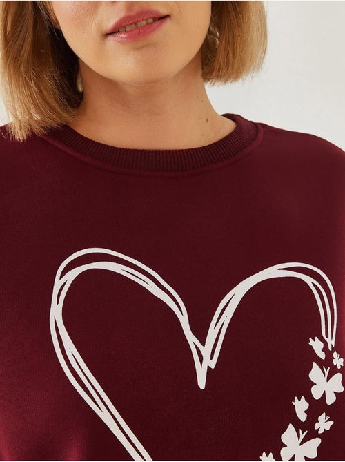 Sudadera de hilo cepillado con cuello redondo y detalle de corazón estampado lucci - Kiabi