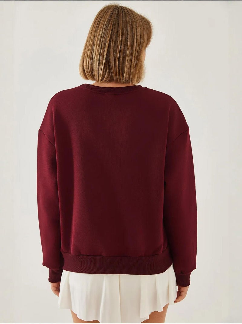 Sudadera de hilo cepillado con cuello redondo y detalle de corazón estampado lucci Rojo burdeos - Kiabi
