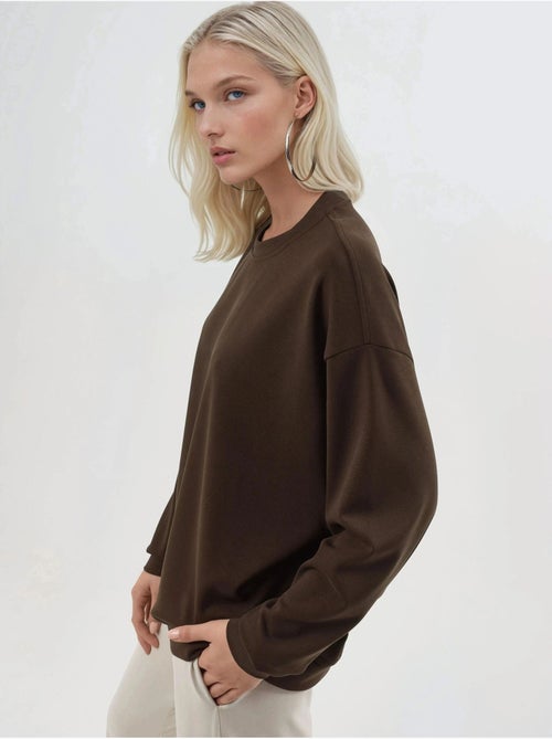 Sudadera de punto con cuello redondo y corte relajado busem - Kiabi Sudadera de punto con cuello redondo y corte relajado busem - Kiabi