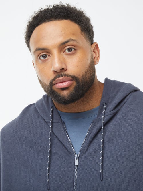 Sudadera de punto de piqué con cierre de cremallera y capucha - Kiabi Sudadera de punto de piqué con cierre de cremallera y capucha - Kiabi