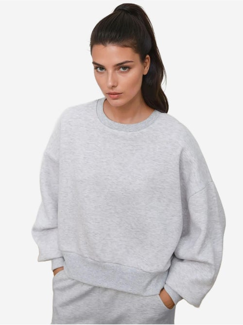 Sudadera de punto holgada con cuello redondo hiccup - Kiabi Sudadera de punto holgada con cuello redondo hiccup - Kiabi
