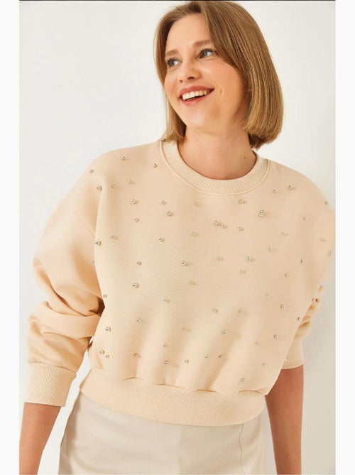 Sudadera de triple hilo cepillado con tachuelas de perlas y cuello redondo lucci - Kiabi Sudadera de triple hilo cepillado con tachuelas de perlas y cuello redondo lucci - Kiabi