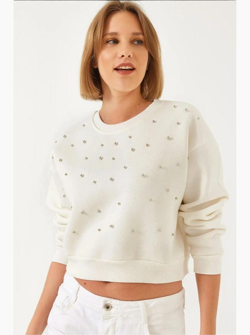 Sudadera de triple hilo cepillado con tachuelas de perlas y cuello redondo lucci - Kiabi Sudadera de triple hilo cepillado con tachuelas de perlas y cuello redondo lucci - Kiabi