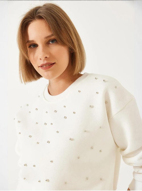 Sudadera de triple hilo cepillado con tachuelas de perlas y cuello redondo lucci - Kiabi Sudadera de triple hilo cepillado con tachuelas de perlas y cuello redondo lucci - Kiabi
