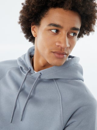 Sudadera lisa con capucha y bolsillos con cremallera