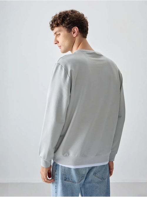 Sudadera lisa de hombre con cuello redondo tommy - Kiabi Sudadera lisa de hombre con cuello redondo tommy - Kiabi